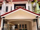 Front view of a townhouse with a covered carport