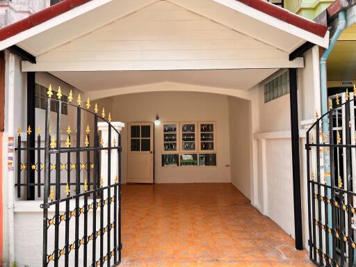 Exterior view of the front entrance and covered patio