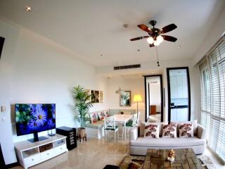 Modern living room with fan, sofa, and TV