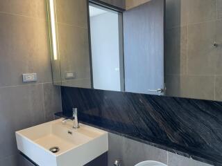 Modern bathroom with sink and large mirror