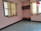 Bedroom with curtains and shelves