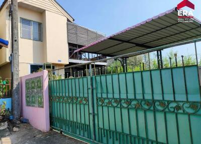 Exterior view of residential building with gated entrance