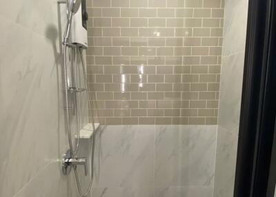 Modern shower with tiled walls