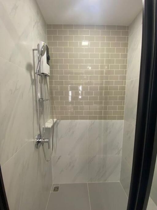 Modern shower with tiled walls