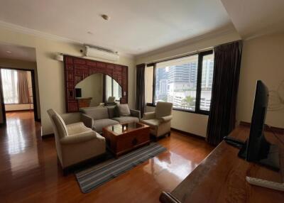 Cozy living room with a large window and city view