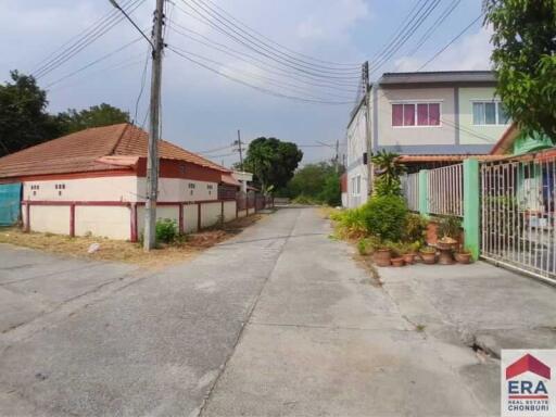 Street view in a neighborhood with houses on both sides