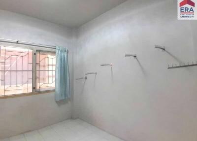 Empty bedroom with window and curtain
