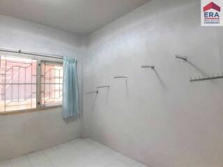 Empty bedroom with window and curtain