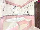 Bathroom with a bathtub, pink and white tiles, and wooden door