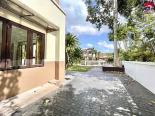 Exterior view of the property with yard and walkway