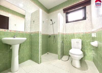 Spacious bathroom with shower and toilet