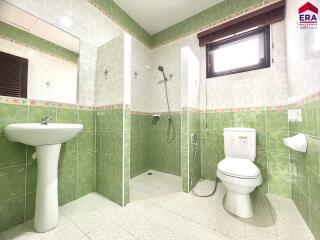 Spacious bathroom with shower and toilet