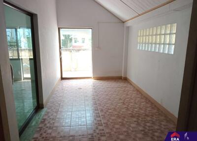 Unfurnished room with tiled flooring and balcony access