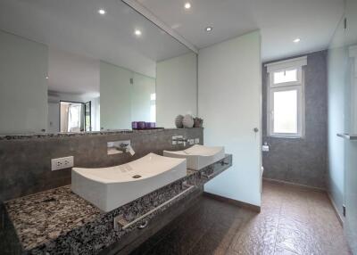 Modern bathroom with double sinks and large mirror