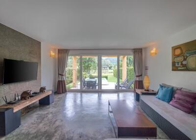 Living room with large glass doors and view of the garden