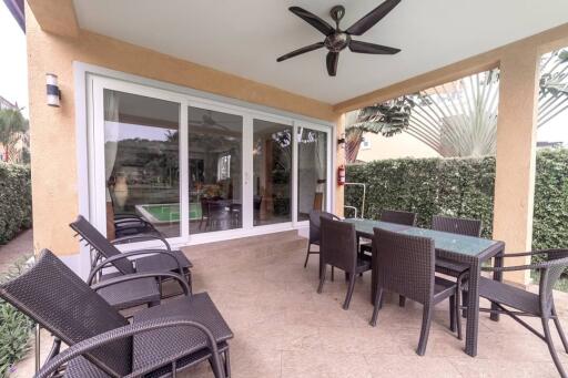 Outdoor patio with dining table and chairs