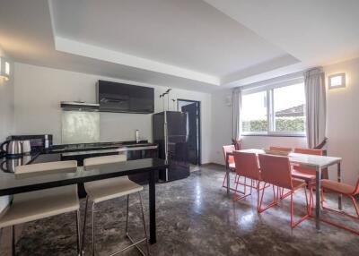 Modern kitchen and dining area with contemporary furnishings