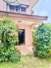 Front view of a house with plants