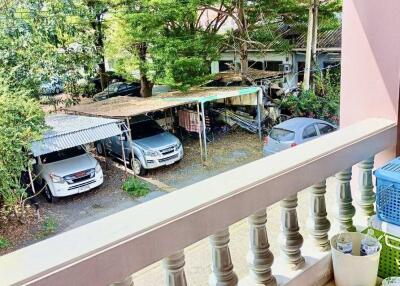 Balcony with view of parking area