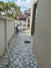 narrow outdoor path with tiled floor