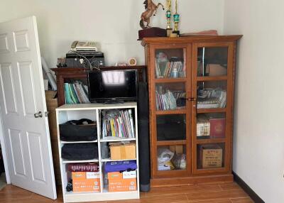 Room with bookshelves and cabinets