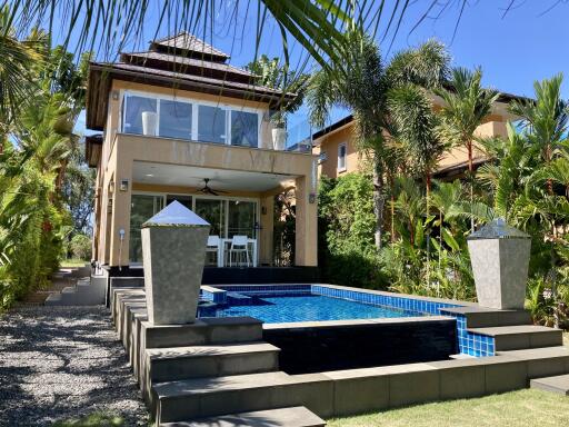 Modern house with pool and outdoor seating area