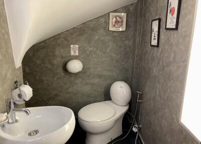 Compact attic bathroom with modern fixtures