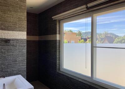 Modern bathroom with large window