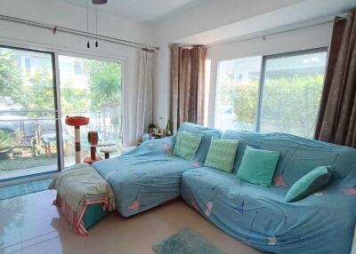 Living room with large windows and garden view