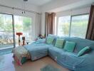 Living room with large windows and garden view