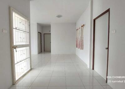 Spacious hall area with white tiled flooring