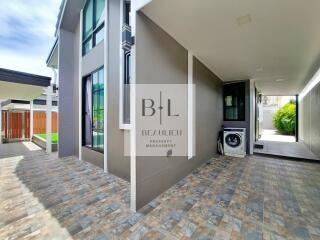 Exterior view of a modern residential building with tiled flooring and laundry area