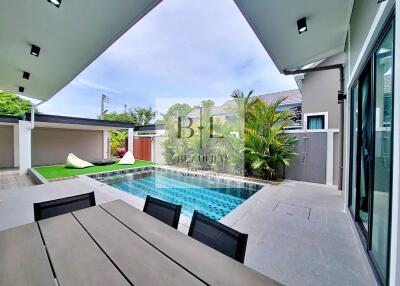 Outdoor terrace with pool and seating area