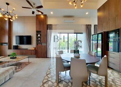 Modern living room with dining area and large windows