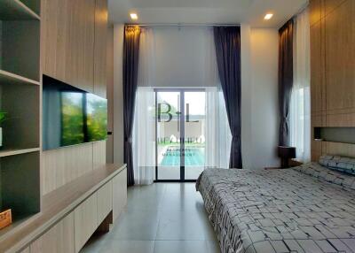 Modern bedroom with large window and elegant décor