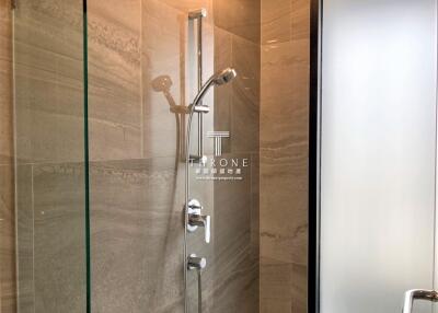 Modern shower in bathroom with glass door