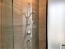 Modern shower in bathroom with glass door