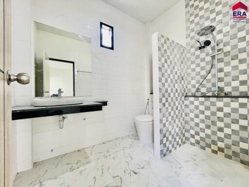 Modern bathroom with checkered tile shower area