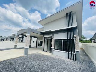 Modern house exterior with driveway and windows