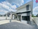 Modern house exterior with driveway and windows