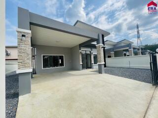 Front view of a modern residential building with a garage