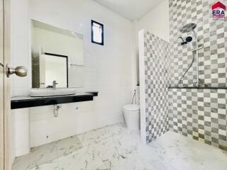 Bathroom with modern fixtures and a walk-in shower