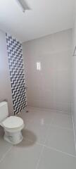 Modern bathroom with tiled wall and floor