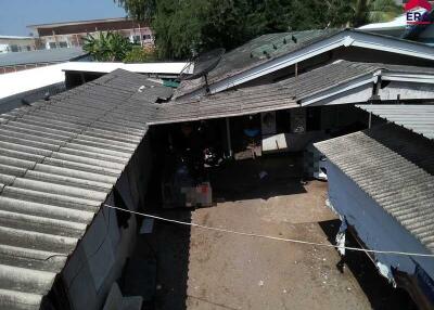 Aerial view of a compound with multiple buildings and a courtyard