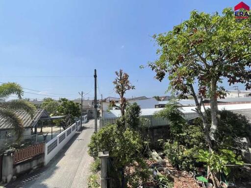 View of street with houses and greenery