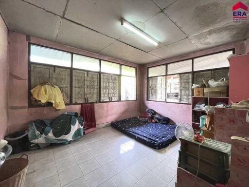 Bedroom with simple furnishing and natural light