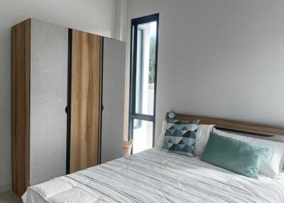 Modern bedroom with wardrobe and bed