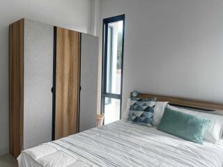 Modern bedroom with wardrobe and bed