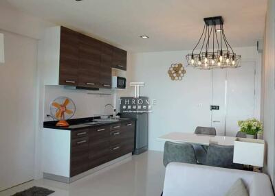 Modern kitchen and dining area with contemporary lighting