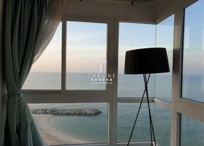 Living room with large windows and ocean view